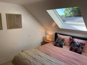 Ένα ή περισσότερα κρεβάτια σε δωμάτιο στο Le Walk'Cottage