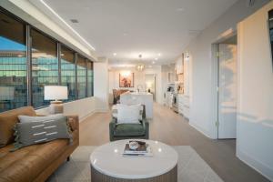 a living room with a couch and a table at Thoroughbred Retreat Unit 803 in Lexington
