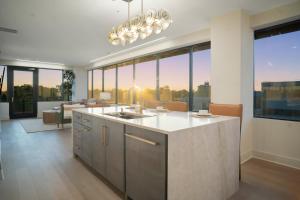 a kitchen with a large group of glass windows at Thoroughbred Retreat Unit 803 in Lexington