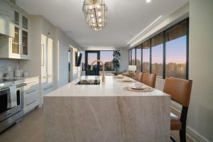 a large kitchen with a large island in the middle at Thoroughbred Retreat Unit 803 in Lexington