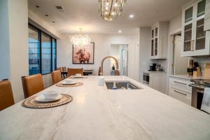 a kitchen with a large marble counter top in a room at Thoroughbred Retreat Unit 803 in Lexington +33 photos