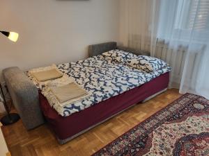 Ένα ή περισσότερα κρεβάτια σε δωμάτιο στο Apartament z tarasem ogrodowym