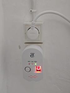 a light hanging from a wall with a lightswitch at Casa Castillo in Montán