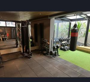 a gym with a punching bag on the wall at High standard apartment for the COP30 in Belém