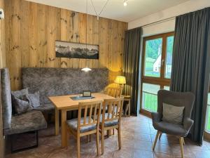 a living room with a table and a couch at Apart Christine in Kaunertal