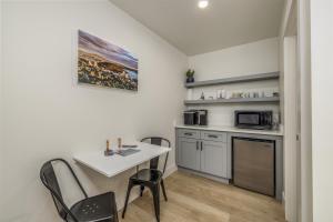 a kitchen with a table and chairs in a room at Cozy Studio in Heart of CDA Only 5 Min to the Resort And Lake in Coeur d'Alene +10 photos
