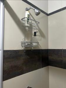 a bathroom with a soap dispenser on a wall at Alojamiento Jaén in Jaén +20 photos