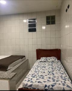 Ένα ή περισσότερα κρεβάτια σε δωμάτιο στο Pousada Lagoa Azul - Ponta da Fruta