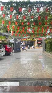 a group of red lanterns hanging over a city street at Nhà Nghỉ PHÚC THỊNH 