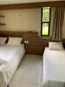 Ένα ή περισσότερα κρεβάτια σε δωμάτιο στο Resort pé na areia perto do Beach park - Mandara Kauai +31 φωτογραφίες