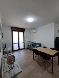 a living room with a table and a couch at Interno 10 in Capolona