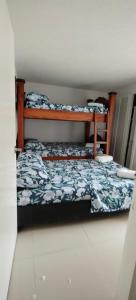a bedroom with two bunk beds in a room at El Rodadero, 4 habitaciones con piscina y terraza in Gaira +25 photos