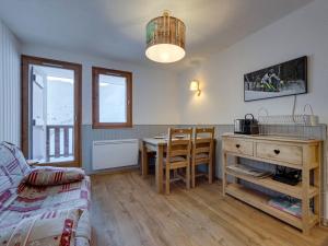 a living room with a table and a dining room at Appartement rénové skis aux pieds, Tignes Le Lac, 4 pers, parking - FR-1-641-16 in Tignes
