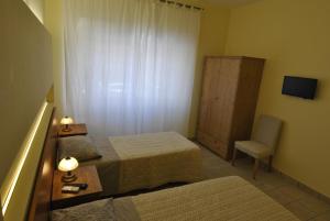Łóżko lub łóżka w pokoju w obiekcie Roma Tourist House