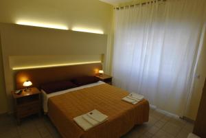 Łóżko lub łóżka w pokoju w obiekcie Roma Tourist House