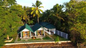 an aerial view of a house in the forest at Sunrise Lake Resort in Polonnaruwa