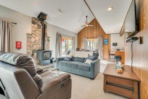 a living room with a couch and a table at Private Dock, Near Skiing Lakefront Gaylord Home in Arbutus Beach