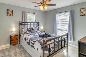 a bedroom with a bed and a ceiling fan at Mins to Beaches and HCA Hospital Fort Pierce Home in Fort Pierce