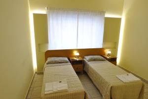 Łóżko lub łóżka w pokoju w obiekcie Roma Tourist House