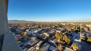 an aerial view of a city with buildings at Oceana Suites Concepto One in Calama +18 photos