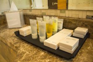 a bunch of glass vases sitting on a table at City Premiere Hotel Apartments - Dubai in Dubai