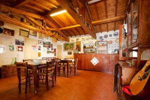 a dining room with wooden tables and chairs at La dimora degli Etruschi in Civitella Cesi