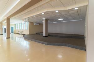 a large empty room with a concrete floor and columns at Hotel Vista Azul in Aguadilla