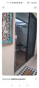 a sliding glass door with a view of a room at Beautiful Room close to the benches in Tarpon Springs