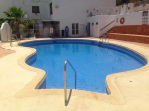 a large swimming pool in the middle of a building at Casa Estrella in Mojácar