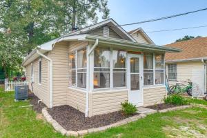a house with a screened in porch at Cozy Cottage Just 2 Blocks From the River! in Colonial Beach