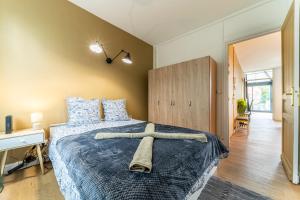 Katil atau katil-katil dalam bilik di L'Holden - 2 beds - Terrace - Wifi - Tram
