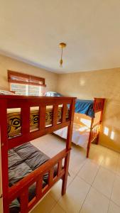 a bedroom with two bunk beds in a room at El Nacimiento 2 in La Granja