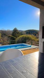a view of a swimming pool from the patio of a house at El Nacimiento 2 in La Granja