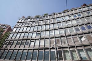 a tall building with a lot of windows at The FLOOR in Milan +80 photos