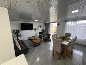a living room with a couch and a table at Casa Hotel Anturio in Montenegro