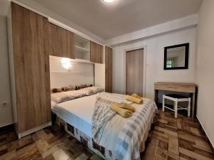 Postel nebo postele na pokoji v ubytování Apartments Dalia