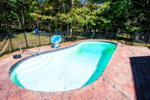 a swimming pool in a yard with at Huge Pocono Dreamhouse 4 bedrooms 12 guests in Blakeslee
