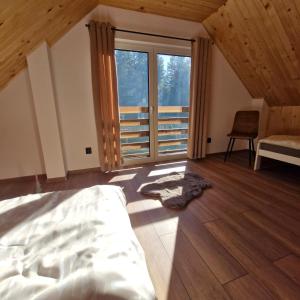 En eller flere senge i et værelse på Osada Golców