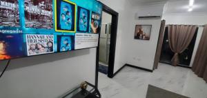 a room with posters on the wall and a hallway at Elegant Escape in Kingston
