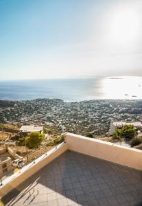 a view of the ocean from the balcony of a house at Viva B&B in Anavyssos