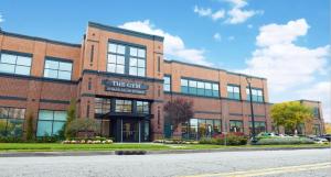 a brick building with a sign that reads the cut at Crowne Plaza Englewood by IHG in Englewood +30 photos