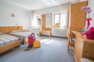 Postel nebo postele na pokoji v ubytování Hotel Melchiori
