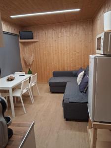 a living room with a couch and a table at Private Pool Douro River View Villa in Covelas