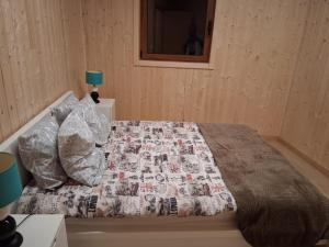 a bedroom with a bed with a quilt on it at Private Pool Douro River View Villa in Covelas +14 photos