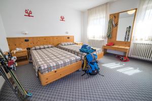 Postel nebo postele na pokoji v ubytování Hotel Melchiori