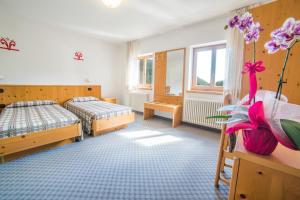 Postel nebo postele na pokoji v ubytování Hotel Melchiori
