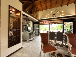 a kitchen and dining room with a table and chairs at exclusive villa - private pool, luxury and comfort in Armenia