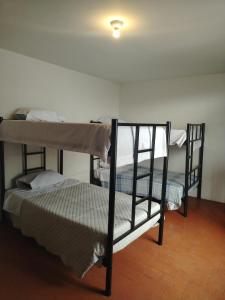 a room with two bunk beds in a room at La casona de margot in Arequipa