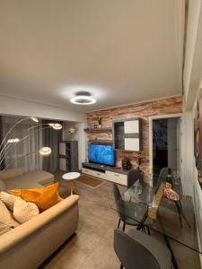 a living room with a couch and a glass table at Brisa Marina in Grao de Castellón +16 photos