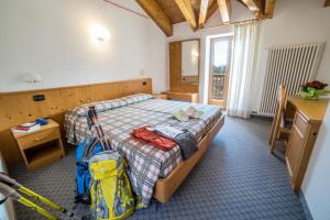 Postel nebo postele na pokoji v ubytování Hotel Melchiori